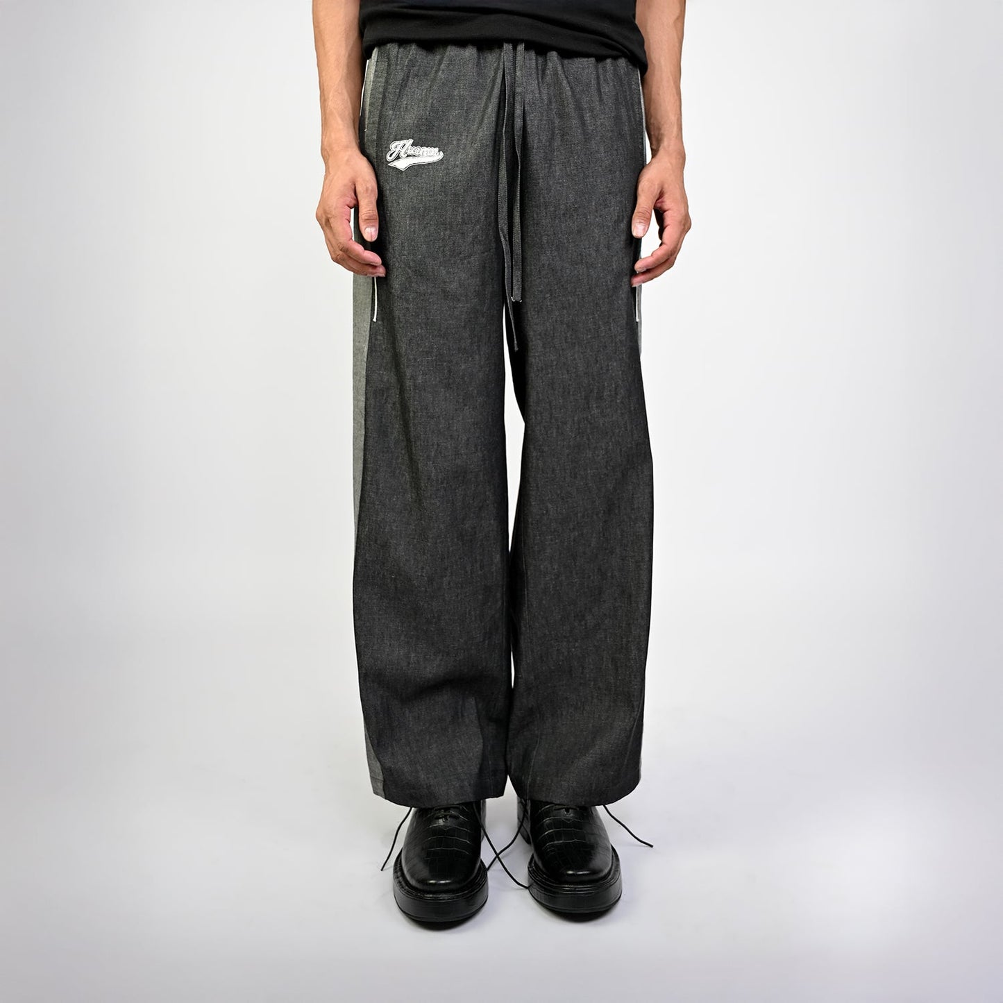 Embroidered denim trackpant with panelled detail (Black)
