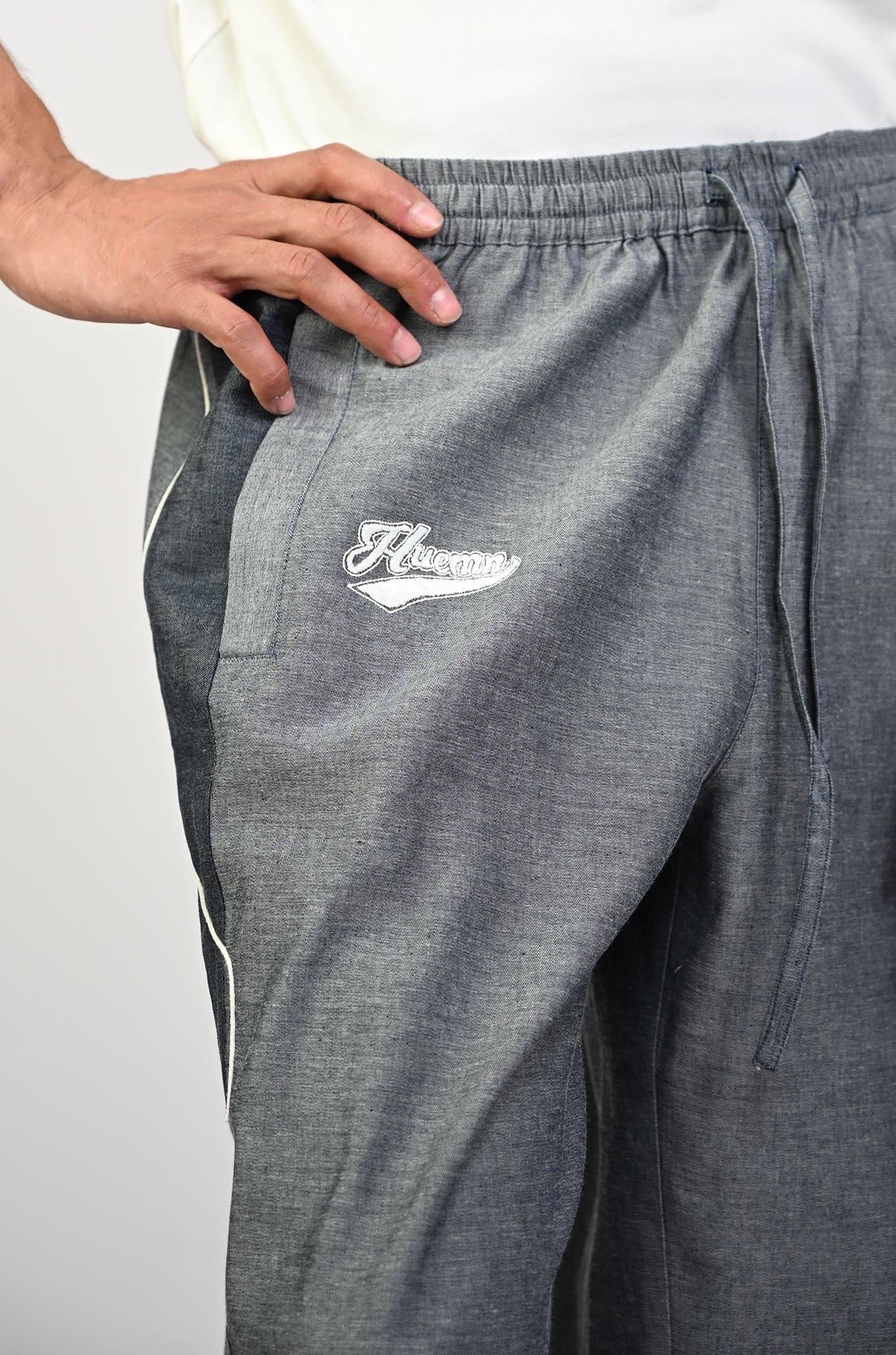 Embroidered denim trackpant with panelled detail (Indigo)