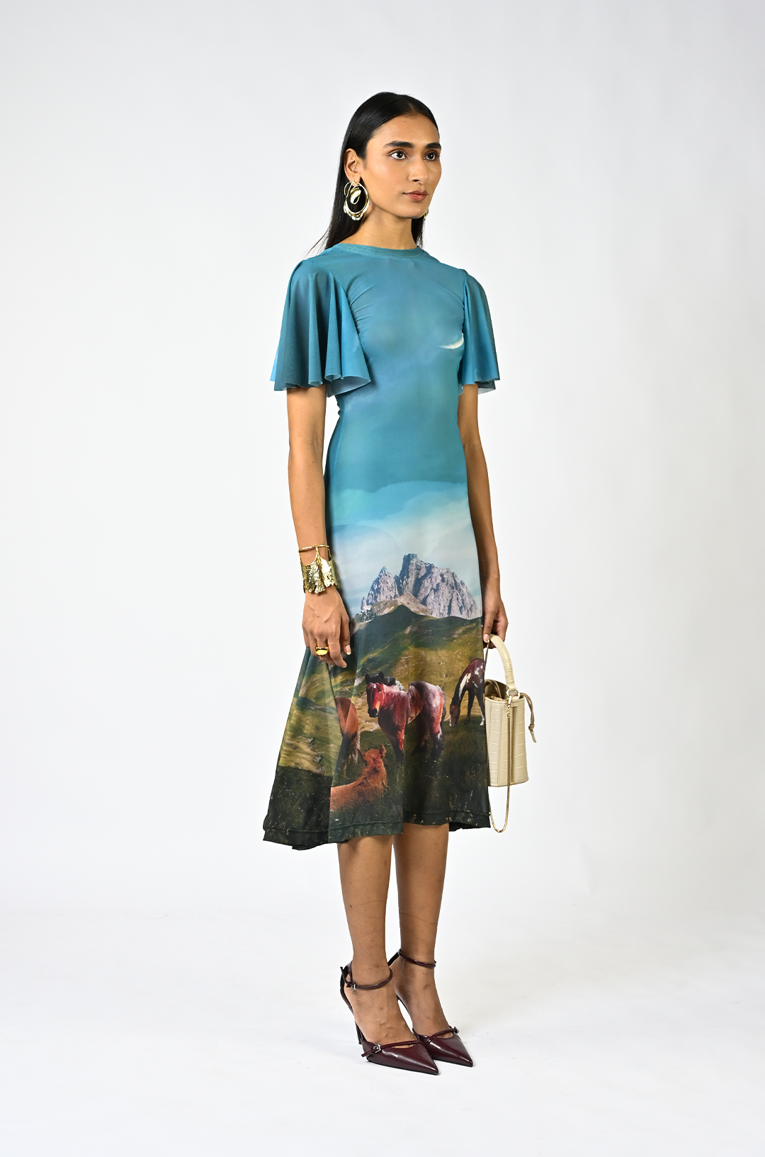 Sculpted horse grazing landscaped lycra dress