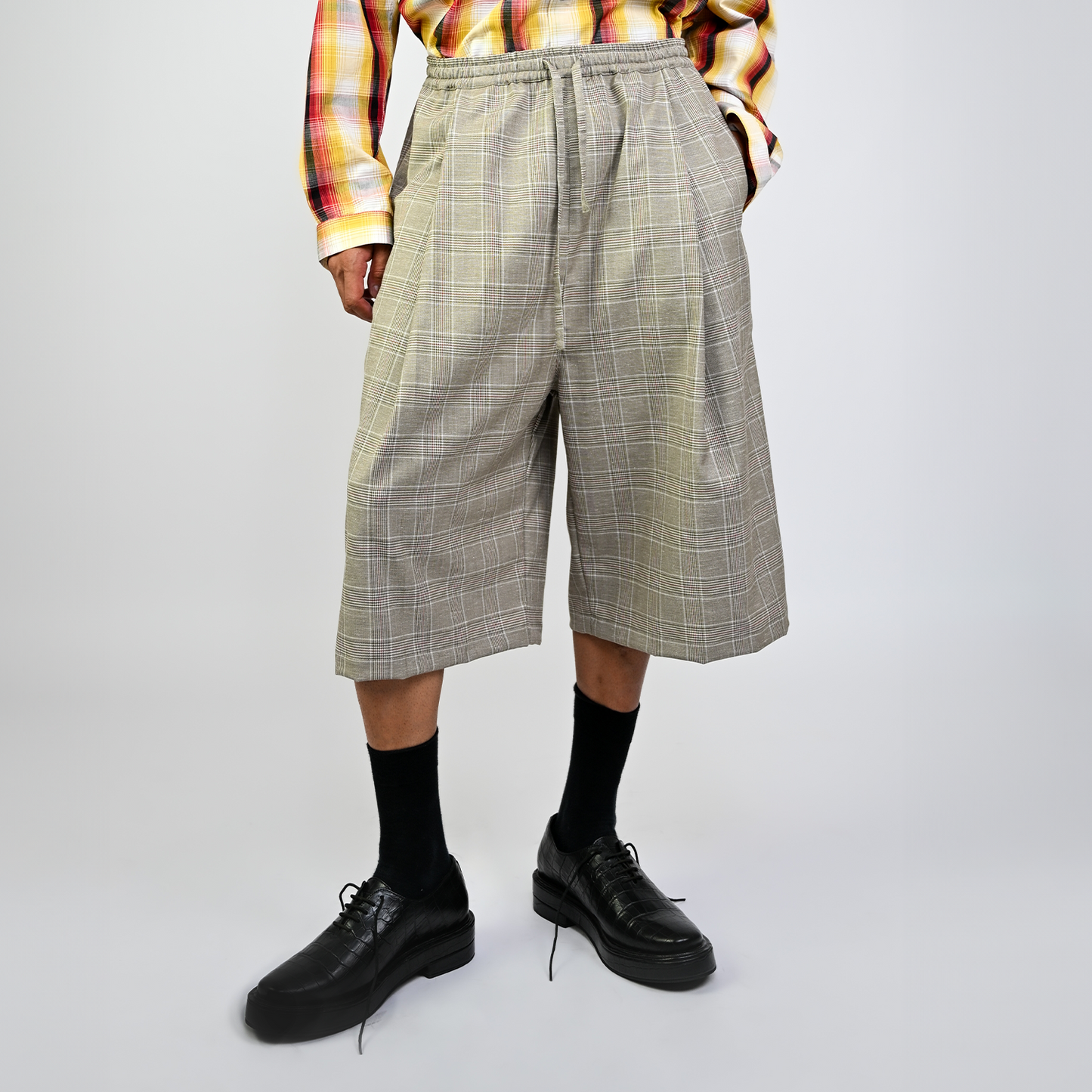 Pleated cullotes in checkered pattern (Beige)