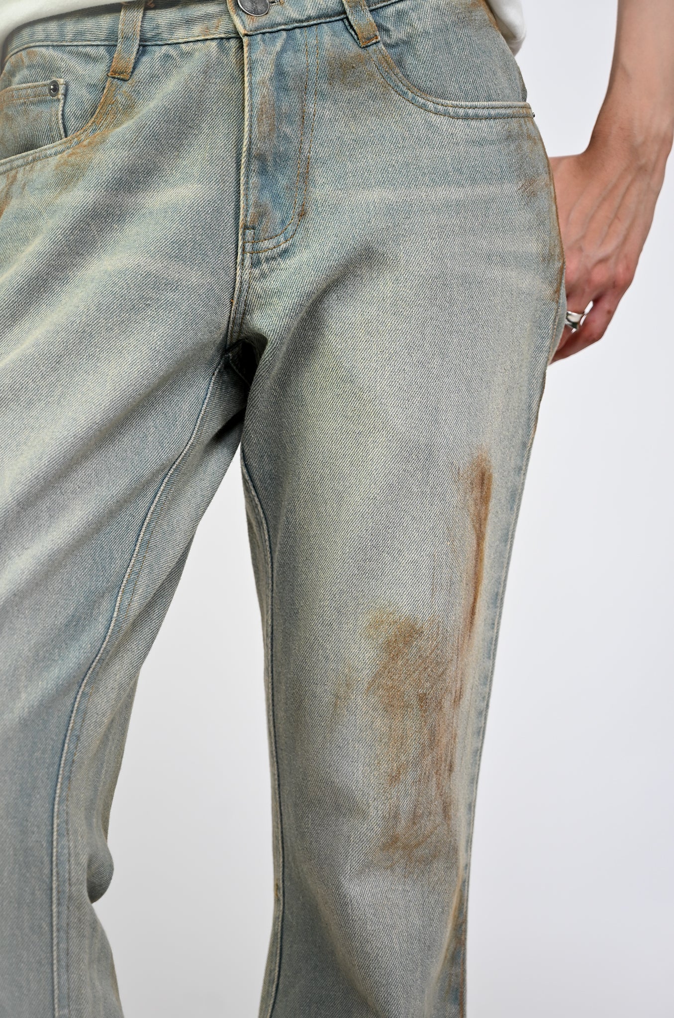 Bootcut denim with hand-painted light mud-washed surface (Indigo)