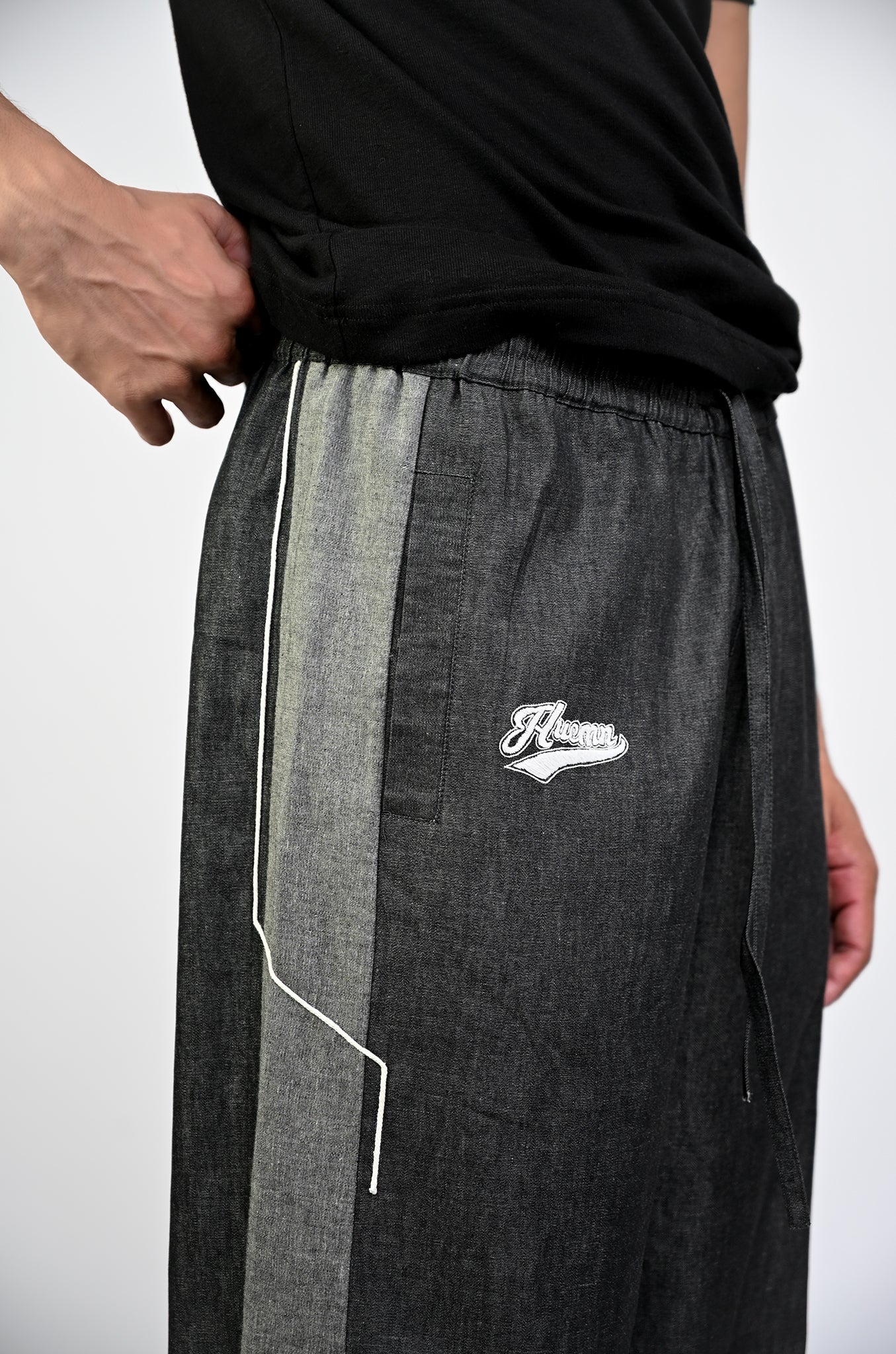 Embroidered denim trackpant with panelled detail (Black)